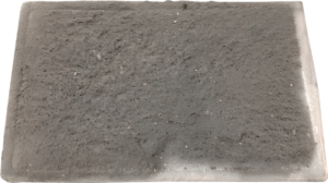 A Photograph of a Dirty MVHR Filter that has collected dirt and needs to either be cleaned or replaced